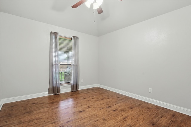 empty room with baseboards, a ceiling fan, and wood finished floors