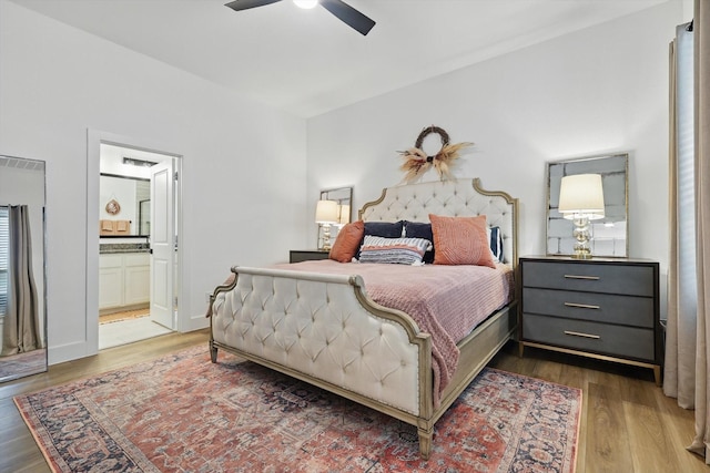 bedroom with ensuite bathroom, a ceiling fan, and wood finished floors
