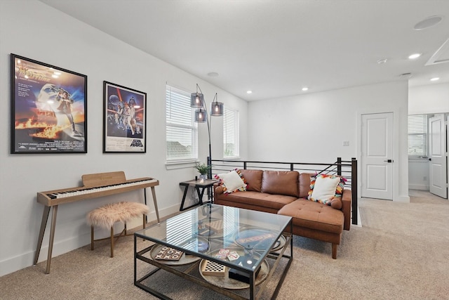living room featuring light colored carpet, recessed lighting, and baseboards
