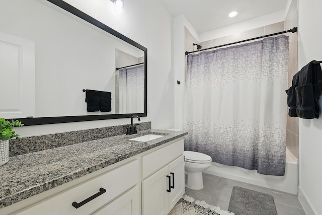 bathroom featuring tile patterned flooring, shower / bath combo, toilet, and vanity