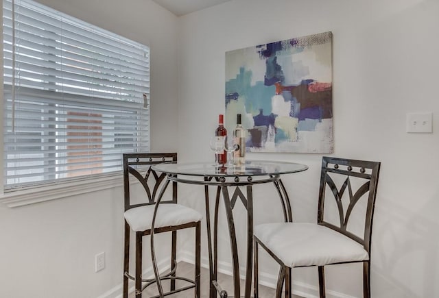 dining space with baseboards