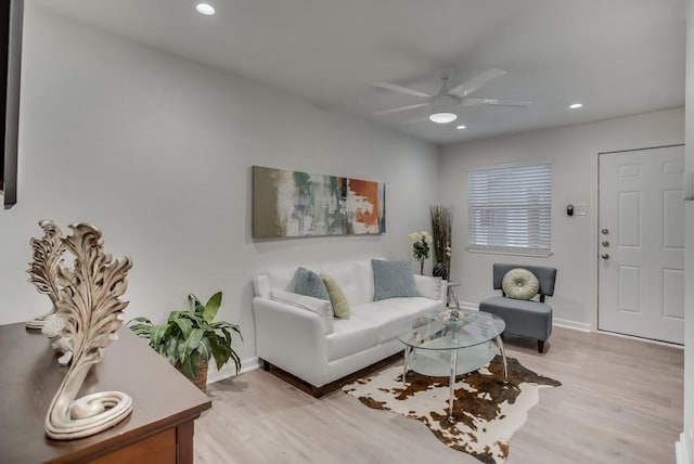 living room with recessed lighting, baseboards, ceiling fan, and light wood finished floors
