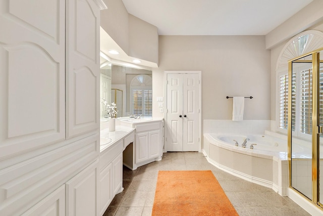 full bath with tile patterned floors, a shower stall, vanity, and a garden tub