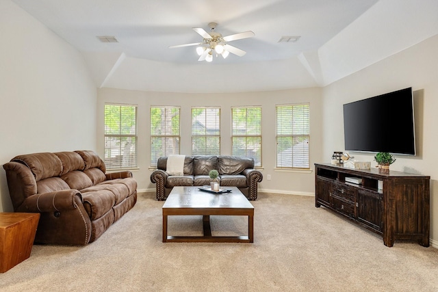 living room featuring light carpet and a healthy amount of sunlight