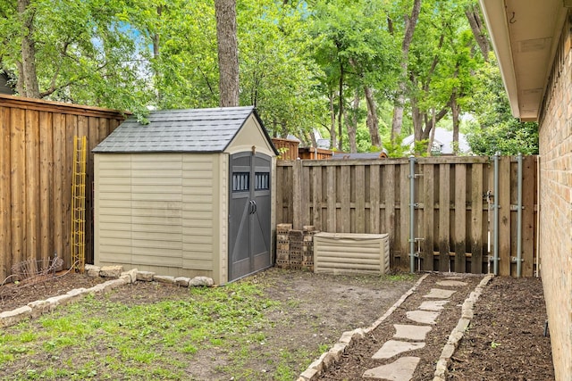 view of shed with a fenced backyard