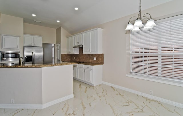 kitchen featuring decorative backsplash, appliances with stainless steel finishes, marble finish floor, a chandelier, and under cabinet range hood