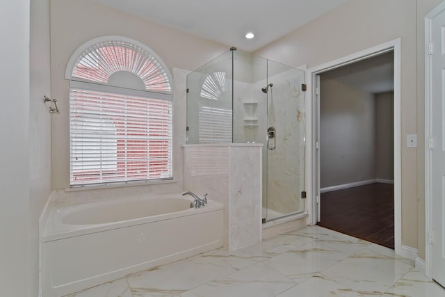 bathroom featuring a garden tub, a stall shower, baseboards, marble finish floor, and recessed lighting