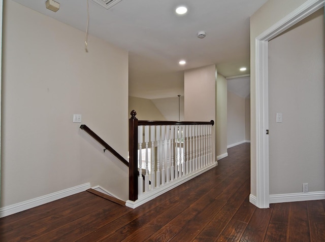 corridor featuring attic access, baseboards, an upstairs landing, recessed lighting, and hardwood / wood-style floors