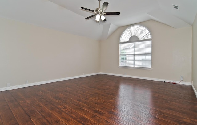 spare room with visible vents, ceiling fan, wood finished floors, and lofted ceiling