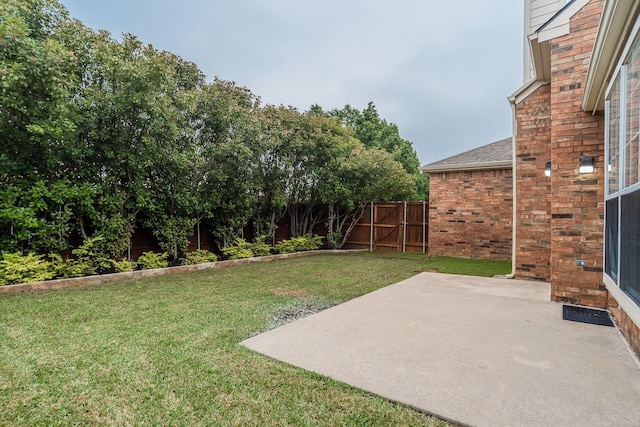 view of yard featuring a patio and fence