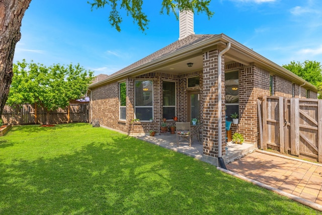 2308 Patriot Dr, Melissa, TX 75454 - view of side of home with fence, brick siding, a chimney, a lawn, and a patio