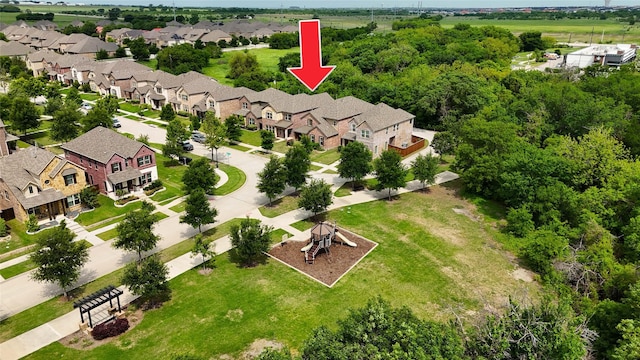 birds eye view of property with a residential view