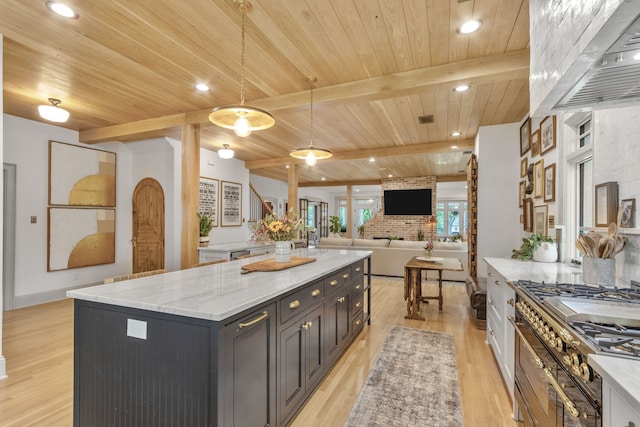 417 N Waddill St, Mckinney, TX 75069 - kitchen featuring wooden ceiling with exposed beams, a kitchen island, light wood-style flooring, decorative light fixtures, and light stone counters