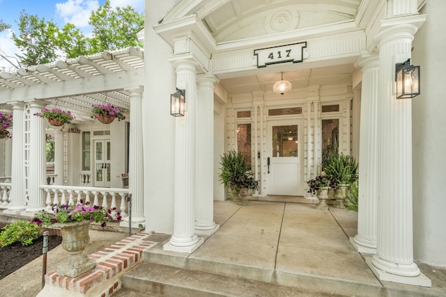 417 N Waddill St, Mckinney, TX 75069 - property entrance featuring covered porch, a pergola, and stone siding