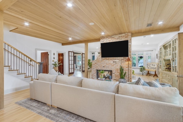417 N Waddill St, Mckinney, TX 75069 - living area featuring wood finished floors, wood ceiling, recessed lighting, french doors, and a brick fireplace