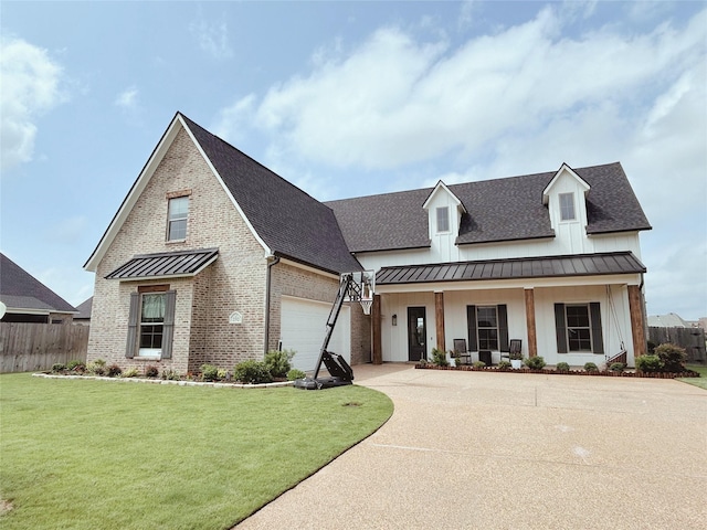 view of front of property with concrete driveway, fence, a standing seam roof, and a shingled roof