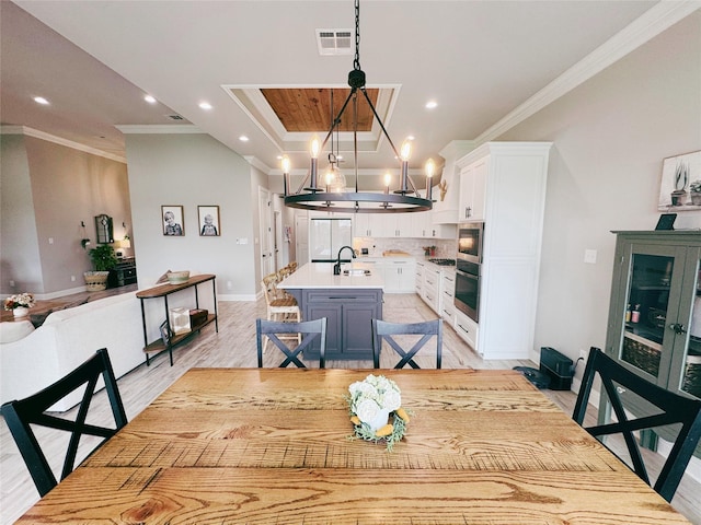 232 Conti Way, Bossier City, LA 71111 - dining area featuring ornamental molding, baseboards, a chandelier, recessed lighting, and light wood-style floors