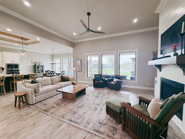 living area featuring ceiling fan, a fireplace, light wood-style floors, recessed lighting, and baseboards