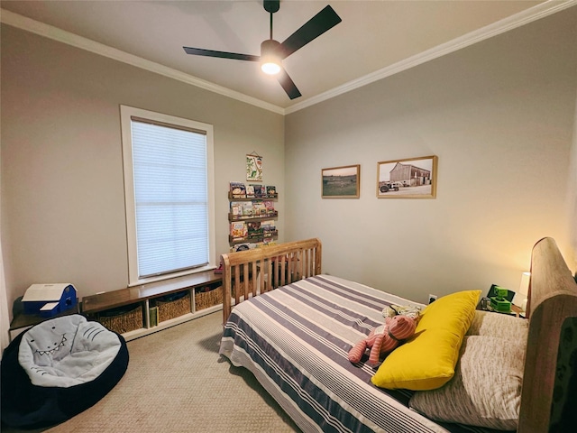 carpeted bedroom featuring ceiling fan and ornamental molding
