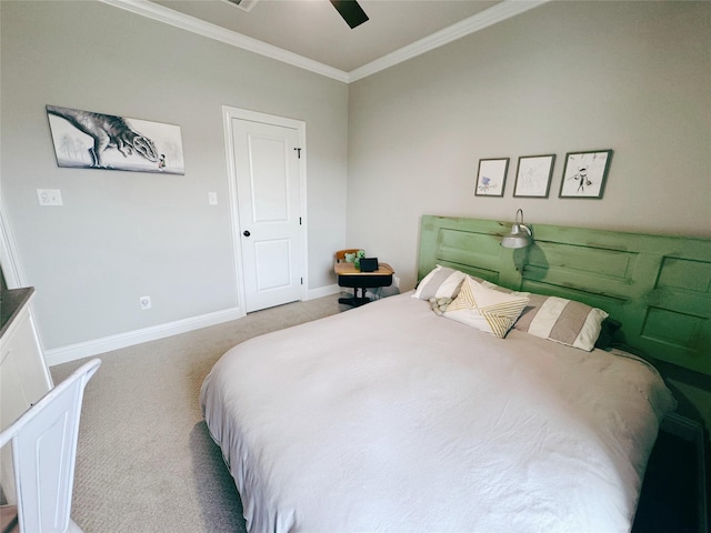 carpeted bedroom featuring crown molding, a ceiling fan, and baseboards