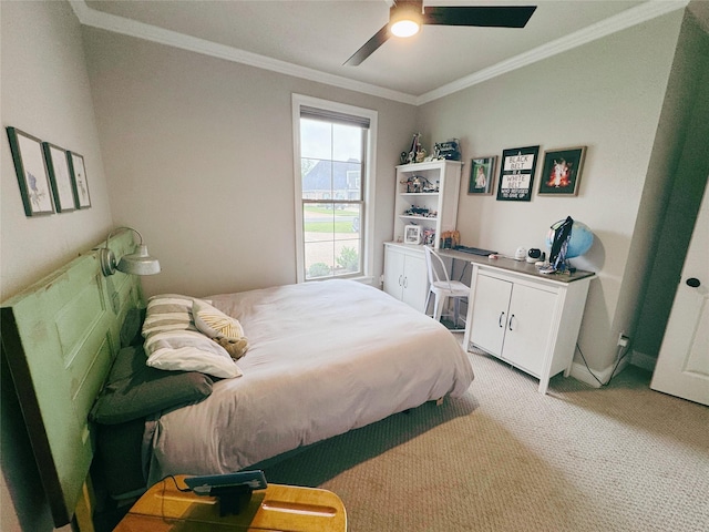 bedroom featuring ornamental molding, ceiling fan, and light colored carpet