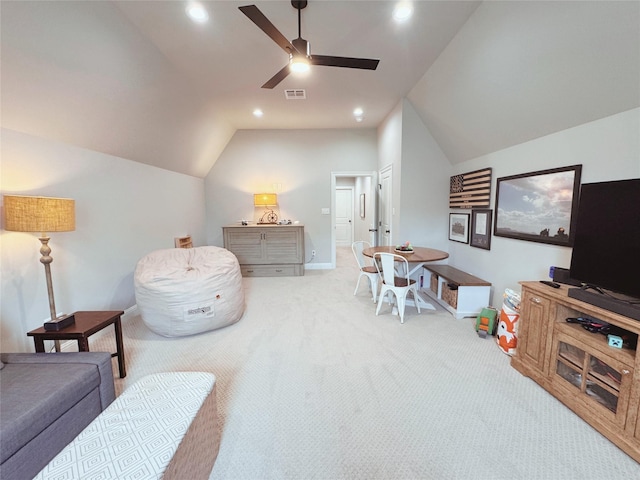 living area with carpet, a ceiling fan, baseboards, lofted ceiling, and visible vents