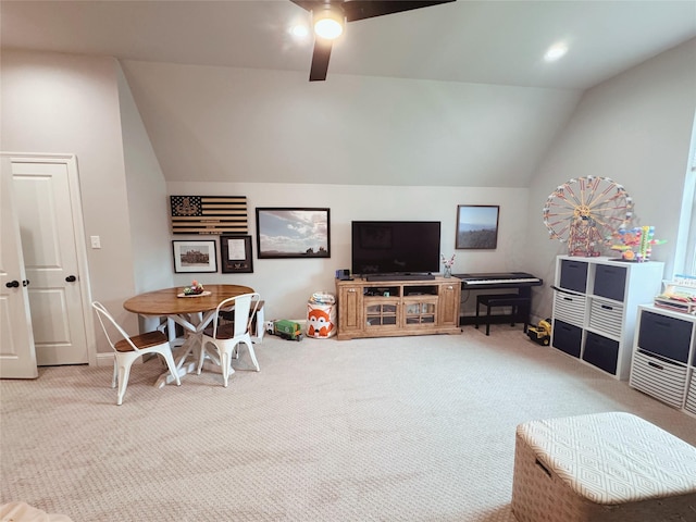 living room featuring baseboards, a ceiling fan, carpet, and vaulted ceiling