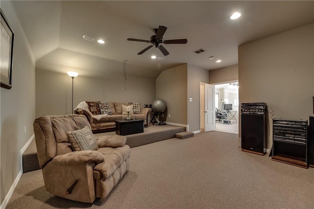 living area with carpet flooring, a ceiling fan, baseboards, and visible vents