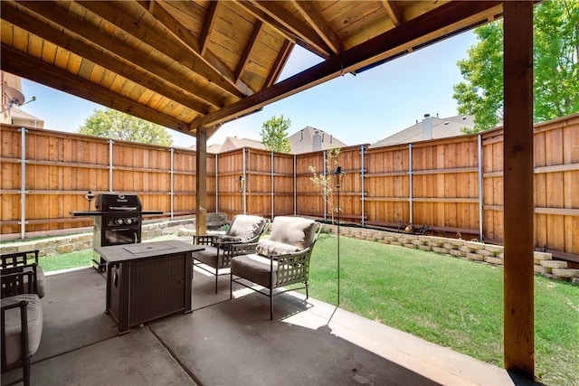 view of patio with a fenced backyard and a grill