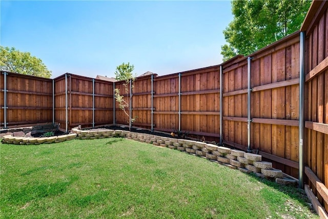view of yard with a fenced backyard