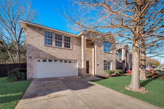 traditional home featuring fence, an attached garage, brick siding, a front yard, and driveway