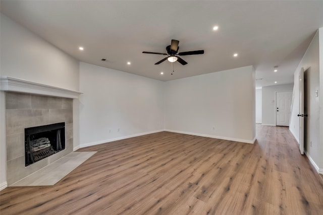 unfurnished living room featuring visible vents, a ceiling fan, recessed lighting, and a tile fireplace