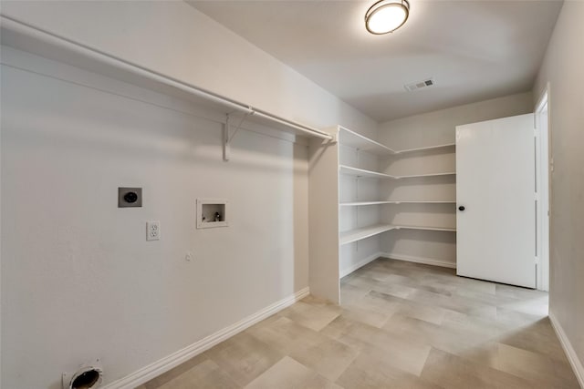 washroom featuring washer hookup, hookup for an electric dryer, laundry area, visible vents, and baseboards