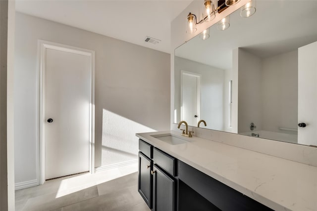 bathroom featuring visible vents and vanity
