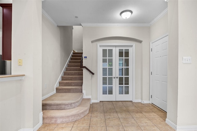 tiled entrance foyer with french doors, stairs, crown molding, and baseboards
