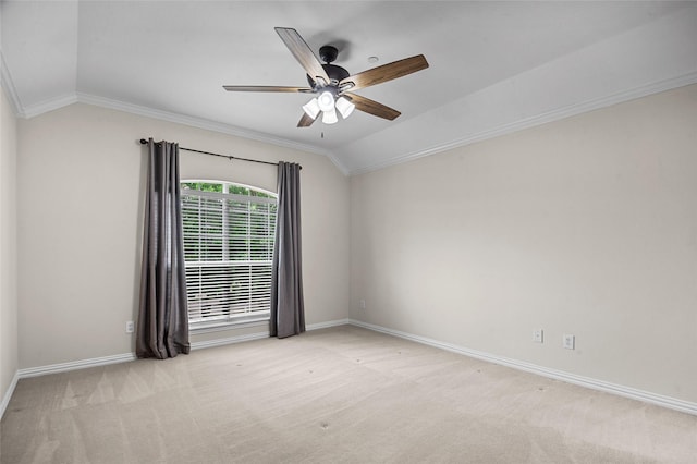 carpeted empty room with baseboards, crown molding, ceiling fan, and lofted ceiling