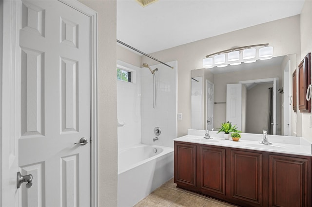bathroom featuring a sink, tile patterned flooring, shower / bathing tub combination, and double vanity