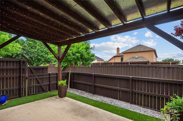 view of patio / terrace featuring a fenced backyard and a gate