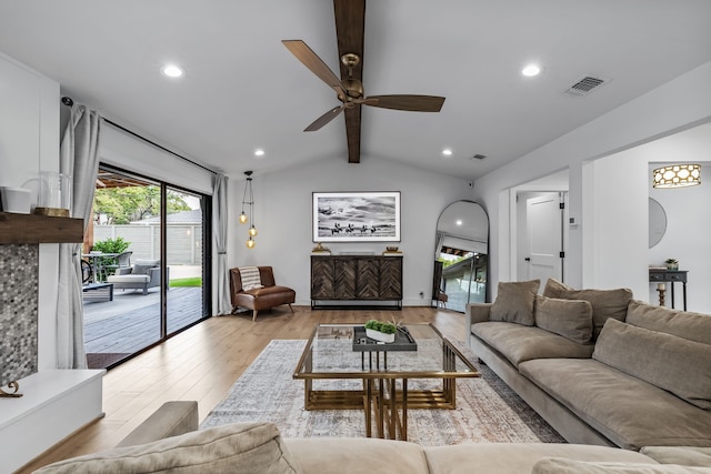 living room featuring a ceiling fan, visible vents, light wood-type flooring, vaulted ceiling with beams, and recessed lighting