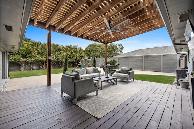 wooden terrace featuring a fenced backyard, a ceiling fan, a playground, and outdoor lounge area