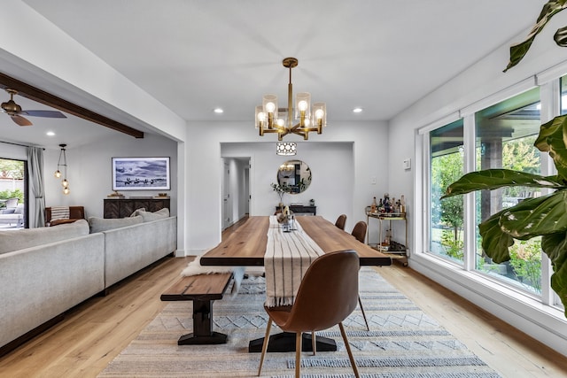dining space with recessed lighting, a notable chandelier, and light wood-style floors