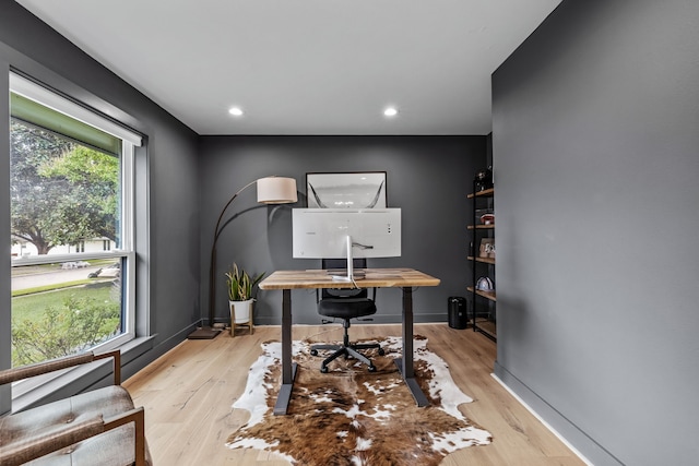 office area featuring recessed lighting, baseboards, and light wood finished floors