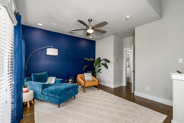 sitting room featuring ceiling fan, visible vents, wood finished floors, baseboards, and recessed lighting