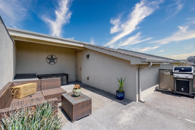 exterior space with an outdoor hangout area and grilling area