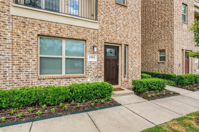 entrance to property with brick siding