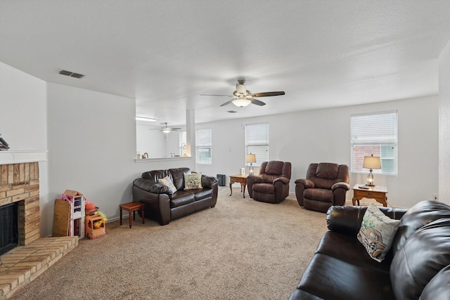 712 Riverflat Dr, Fort Worth, TX 76179 - carpeted living room with ceiling fan, visible vents, plenty of natural light, and a fireplace