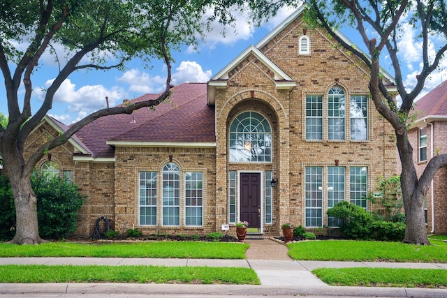 5624 Big River Dr, The Colony, TX 75056 - view of front facade featuring a front yard and brick siding