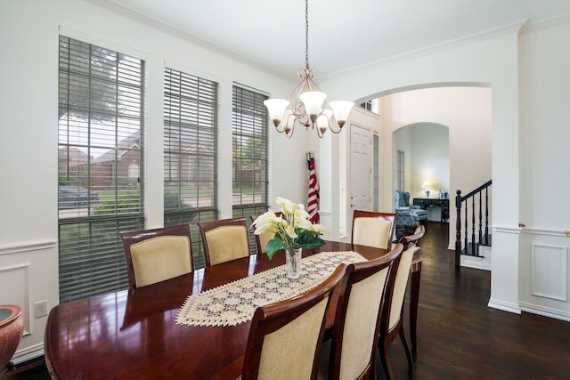5624 Big River Dr, The Colony, TX 75056 - dining area with crown molding, arched walkways, a healthy amount of sunlight, and an inviting chandelier