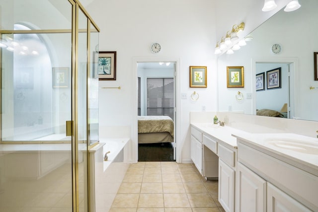 5624 Big River Dr, The Colony, TX 75056 - ensuite bathroom featuring double vanity, a sink, tile patterned flooring, a shower stall, and ensuite bath