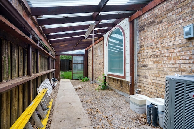 5624 Big River Dr, The Colony, TX 75056 - view of property exterior with brick siding, central AC unit, and fence